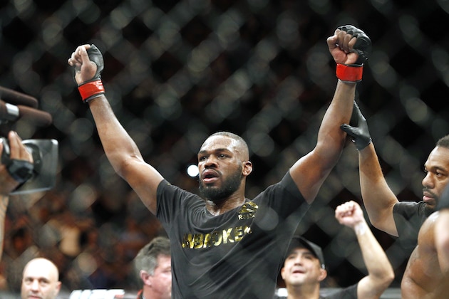 FILE - This Jan. 3, 2015, file photo shows Jon Jones celebrates after defeating Daniel Cormier during their light heavyweight title mixed martial arts bout in Las Vegas. Albuquerque police were searching for UFC light heavyweight champion Jones on Sunday night, April 26, 2015, in connection with a hit-and-run accident. Police spokesman Officer Simon Drobik said Jones is wanted for questioning about the crash, which occurred earlier in the day. No charges have been filed, but a pregnant woman driving another vehicle was hospitalized with minor injuries. (AP Photo/John Locher, File)