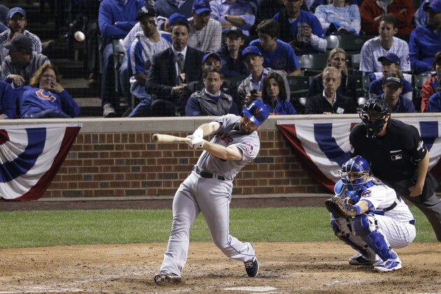 New York Mets' Daniel Murphy hits a two-run home run during the eighth inning of Game 4 of the National League baseball championship series against the Chicago Cubs Wednesday, Oct. 21, 2015, in Chicago. (AP Photo/David Goldman)