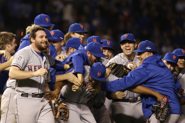 The New York Mets celebrate after Game 4 of the National League baseball championship series against the Chicago Cubs Wednesday, Oct. 21, 2015, in Chicago. The Mets won 8-3 to advance to the World Series. (AP Photo/David J. Phillip)