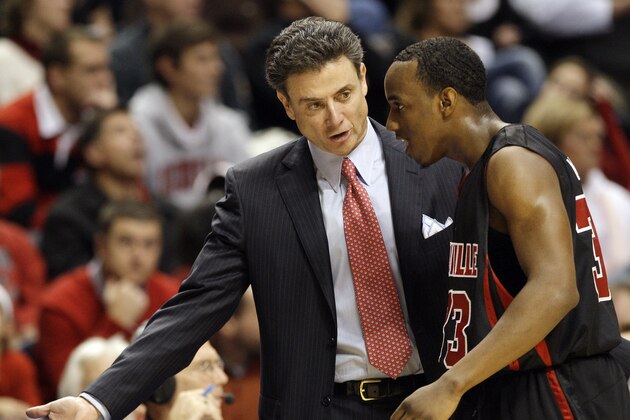 Louisville head coach Rick Pitino talks with guard Andre McGee, right, in the first half of an NCAA college basketball game against Western Kentucky in Nashville, Tenn., Sunday, Nov. 30, 2008. Western Kentucky upset Louisville 68-54. (AP Photo/Mark  Humphrey)