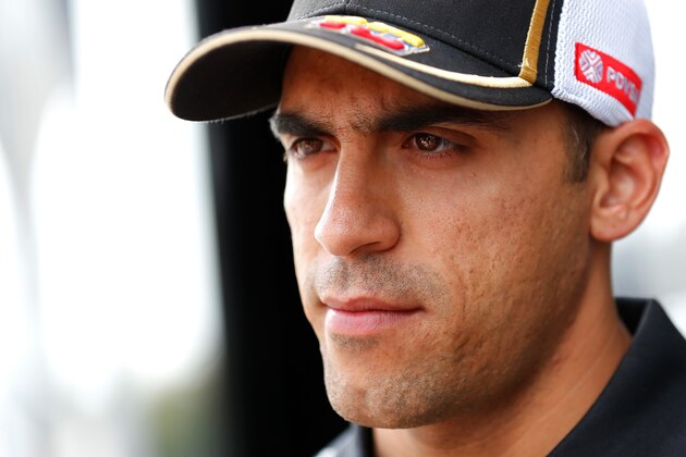 MONZA, ITALY - SEPTEMBER 03:  Pastor Maldonado of Venezuela and Lotus speaks with members of the media in the paddock during previews to the Formula One Grand Prix of Italy at Autodromo di Monza on September 3, 2015 in Monza, Italy.  (Photo by Charles Coates/Getty Images)