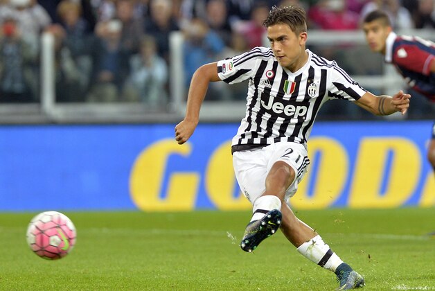 Juventus Argentine forward Paulo Dybala scores on a penalty kick during a Serie A soccer match between Juventus and Bologna at the Juventus stadium, in Turin, Italy, Sunday, Oct. 4, 2015. (AP Photo/Massimo Pinca)