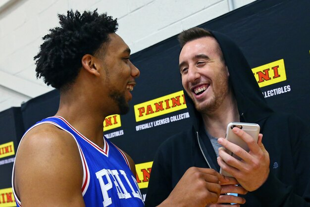 TARRYTOWN, NY - AUGUST 8:  Jahlil Okafor #8 of the Philadelphia 76ers and Frank Kaminsky of the Charlotte Hornets share a laugh during the 2015 NBA rookie photo shoot on August 8, 2015 at the Madison Square Garden Training Facility in Tarrytown, New York. NOTE TO USER: User expressly acknowledges and agrees that, by downloading and or using this photograph, User is consenting to the terms and conditions of the Getty Images License Agreement. Mandatory Copyright Notice: Copyright 2015 NBAE (Photo by Mike Stobe/NBAE via Getty Images)