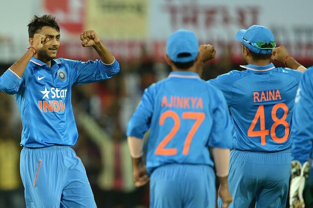 India's Axar Patel (L) reacts after taking the wicket of South Africa's Hashim Amla during the second one day international (ODI) cricket match between India and South Africa at The Holkar Cricket Stadium at Indore on October 14, 2015. AFP PHOTO/ INDRANIL MUKHERJEE ----IMAGE RESTRICTED TO EDITORIAL USE - STRICTLY NO COMMERCIAL USE---        (Photo credit should read INDRANIL MUKHERJEE/AFP/Getty Images)