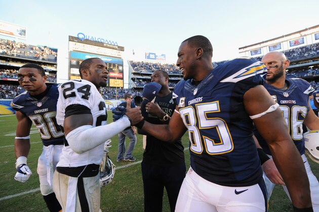 SAN DIEGO, CA - NOVEMBER 16:   Charles Woodson #24 of the Oakland Raiders congratulated  Antonio Gates #85 of the San Diego Chargers after the Chargers defeated the Oakland Raiders 13-6 in the game at Qualcomm Stadium on November 16, 2014 in San Diego, California.  (Photo by Donald Miralle/Getty Images)