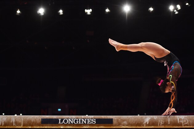 Britain's Claudia Fragapane competes on the beam during the first day of qualifications at the 2015 World Gymnastics Championship in Glasgow, Scotland, on October 23, 2015. Gymnasts can secure qualification for the 2016 Rio Games at the championships which will be staged at the Hydro Arena. AFP PHOTO / BEN STANSALL        (Photo credit should read BEN STANSALL/AFP/Getty Images)