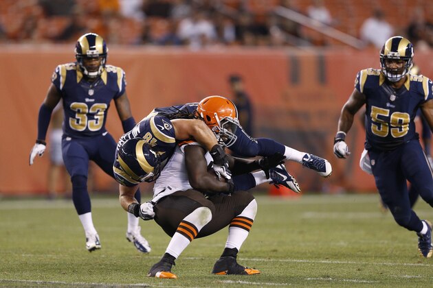 CLEVELAND, OH - AUGUST 23: Johnny Millard #48 of the St. Louis Rams makes a tackle against MarQueis Gray #47 of the Cleveland Browns during an NFL preseason game at FirstEnergy Stadium on August 23, 2014 in Cleveland, Ohio. (Photo by Joe Robbins/Getty Images)