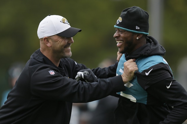 Jacksonville Jaguars head coach Gus Bradley, left, and wide receiver Allen Robinson attend a training session Allianz Park in London, Friday Oct. 23, 2015. The Jaguars are preparing for an NFL football game against the Buffalo Bills at London's Wembley stadium on Sunday. (AP Photo/Tim Ireland)