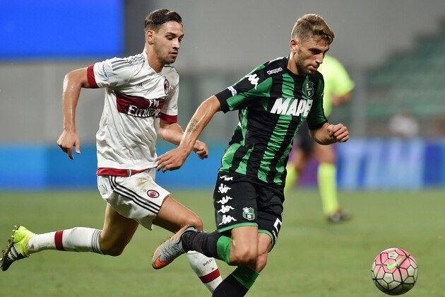 REGGIO NELL'EMILIA, ITALY - AUGUST 12:  Mattia De Sciglio of Milan and Domenico Berardi of Sassuolo in action during the TIM pre-season tournament match between AC Milan and US Sassuolo Calcio at Mapei Stadium - Città del Tricolore on August 12, 2015 in Reggio nell'Emilia, Italy.  (Photo by Giuseppe Bellini/Getty Images)