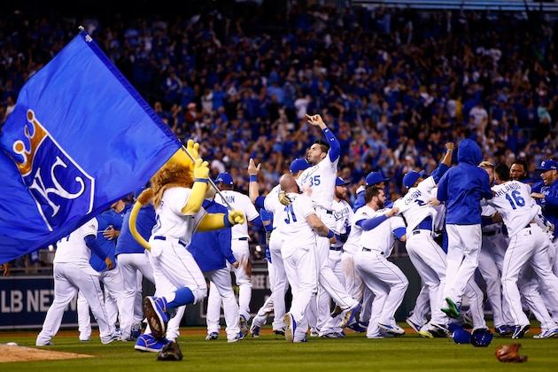 KANSAS CITY, MO - OCTOBER 23:  The Kansas City Royals celebrate the 4-3 victory against the Toronto Blue Jays in game six of the 2015 MLB American League Championship Series at Kauffman Stadium on October 23, 2015 in Kansas City, Missouri.  (Photo by Jamie Squire/Getty Images)