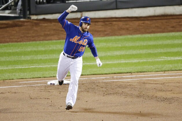 New York Mets' Daniel Murphy celebrates after hitting a two-run home run during the first inning of Game 2 of the National League baseball championship series against the Chicago Cubs Sunday, Oct. 18, 2015, in New York. (AP Photo/David Goldman)