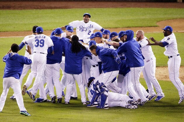 Kansas City Royals celebrates their 4-3 win against the Toronto Blue Jays in Game 6 of baseball's American League Championship Series on Friday, Oct. 23, 2015, in Kansas City, Mo. (AP Photo/Jae C. Hong)