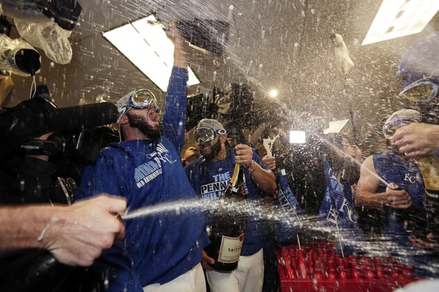 Kansas City Royals celebrates their 4-3 win against the Toronto Blue Jays in Game 6 of baseball's American League Championship Series on Friday, Oct. 23, 2015, in Kansas City, Mo. (AP Photo/Charlie Riedel)