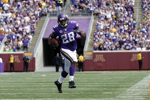 Minnesota Vikings running back Adrian Peterson (28) runs against the Detroit Lions in the second half of an NFL football game in Minneapolis, Sunday, Sept. 20, 2015. (AP Photo/Jim Mone)