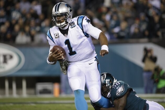 Carolina Panthers' Cam Newton, left, is tackled by Philadelphia Eagles' Trent Cole during the first half of an NFL football game, Monday, Nov. 10, 2014, in Philadelphia. (AP Photo/Matt Rourke)