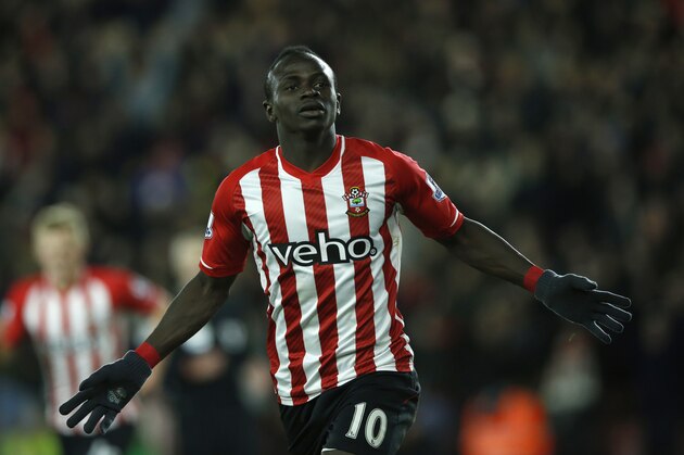 Southampton’s Sadio Mane celebrates after scoring the opening goal of the game during the English Premier League soccer match between Southampton and Crystal Palace, at St Mary's stadium in Southampton, England, Tuesday, March 3, 2015. (AP Photo/Alastair Grant)