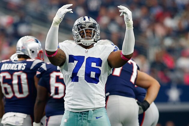 ARLINGTON, TX - OCTOBER 11:  Greg Hardy #76 of the Dallas Cowboys encourages the crowd to make noise during the first half of the NFL game against the New England Patriots at AT&T Stadium on October 11, 2015 in Arlington, Texas.  (Photo by Mike Stone/Getty Images)