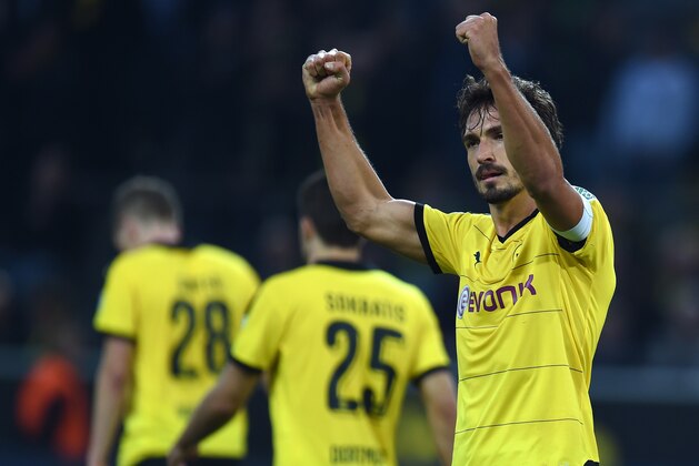 Dortmund's defender Mats Hummels reacts during the German first division Bundesliga football match Borussia Dortmund vs Bayer Leverkusen in Dortmund, western Germany on September 20, 2015. Dortmund won the match 3-0.   AFP PHOTO / PATRIK STOLLARZ

RESTRICTIONS: DURING MATCH TIME: DFL RULES TO LIMIT THE ONLINE USAGE TO 15 PICTURES PER MATCH AND FORBID IMAGE SEQUENCES TO SIMULATE VIDEO. 
== RESTRICTED TO EDITORIAL USE ==  FOR FURTHER QUERIES PLEASE CONTACT DFL DIRECTLY AT + 49 69 650050.        (Photo credit should read PATRIK STOLLARZ/AFP/Getty Images)