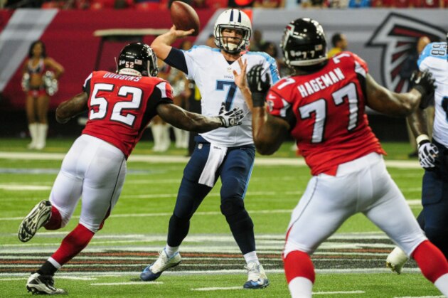 ATLANTA, GA - AUGUST 23: Zach Mettenberger #7 of the Tennessee Titans throws a pass under pressure from Tim Dobbins #52 of the Atlanta Falcons in the second half of a preseason game at the Georgia Dome on August 23, 2014 in Atlanta, Georgia.  (Photo by Scott Cunningham/Getty Images)