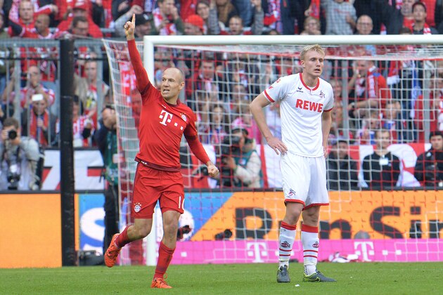 Bayern's Arjen Robben, left,  celebrates after scoring the opening goal  during the German Bundesliga soccer match between FC Bayern Munich and FC Cologne in the Allianz Arena in Munich, Germany, on Saturday, Oct. 24, 2015. (AP Photo/Kerstin Joensson)