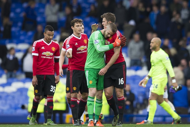 Manchester United's goalkeeper David De Gea, centre left, celebrates with teammates after their team's 3-0 win in the English Premier League soccer match between Everton and Manchester United at Goodison Park Stadium, Liverpool, England, Saturday Oct. 17, 2015. (AP Photo/Jon Super)