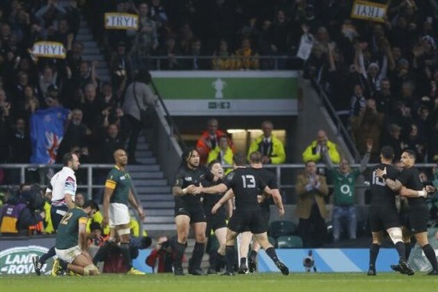 New Zealand's Beauden Barrett celebrates scoring a try during the Rugby World Cup semifinal match between South Africa and New Zealand at Twickenham Stadium, London, Saturday, Oct. 24, 2015. (AP Photo/Frank Augstein)