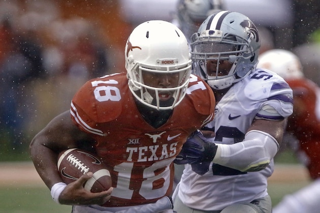 Texas quarterback Tyrone Swoopes (18) runs for a first down against Kansas State Charmeachealle Moore (52) during the second half of an NCAA college football game, Saturday, Oct. 24, 2015, in Austin, Texas. Texas won 23-9. (AP Photo/Michael Thomas) Texas quarterback Tyrone Swoopes (18) runs for a first down against Kansas State Charmeachealle Moore (52) during the second half of an NCAA college football game, Saturday, Oct. 24, 2015, in Austin, Texas. Texas won 23-9. (AP Photo/Michael Thomas)