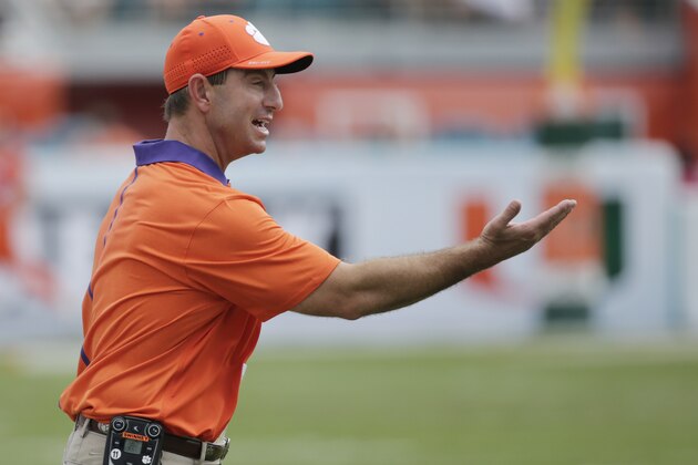 Clemson head coach Dabo Swinney argues a call during the first half of an NCAA College football game, Saturday, Oct. 24, 2015 in Miami Gardens, Fla. No. 6 Clemson handed Miami its worst defeat in the program's 90-year history Saturday, rolling to a 58-0 win to remain unbeaten. (AP Photo/Wilfredo Lee)