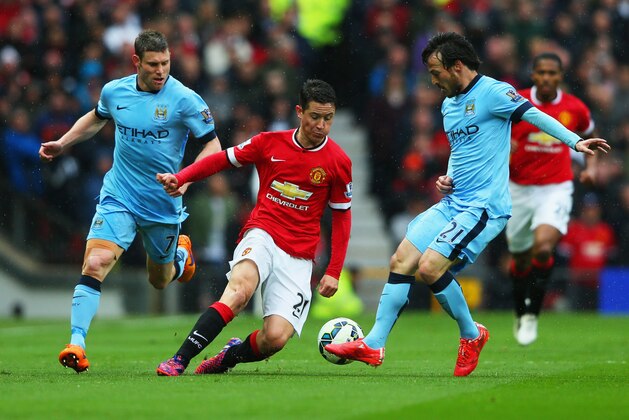 MANCHESTER, ENGLAND - APRIL 12:  Ander Herrera of Manchester United (C) takes on James Milner (L) and David Silva of Manchester City (R) during the Barclays Premier League match between Manchester United and Manchester City at Old Trafford on April 12, 2015 in Manchester, England.  (Photo by Alex Livesey/Getty Images)