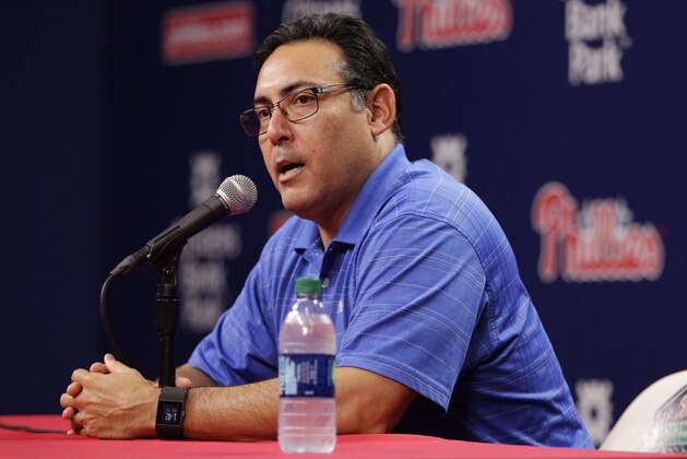 Philadelphia Phillies Senior Vice President & General Manager Ruben Amaro Jr. takes questions from the media after trading starting pitcher Cole Hamels  prior to the first inning of a baseball game against the Atlanta Braves, Friday, July 31, 2015, in Philadelphia. (AP Photo/Chris Szagola)
