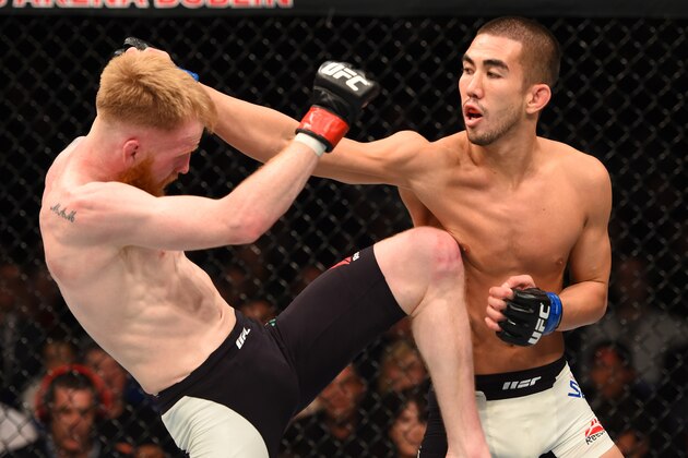 DUBLIN, IRELAND - OCTOBER 24:  (R-L) Louis Smolka punches Paddy Holohan in their flyweight fight during the UFC event at 3Arena on October 24, 2015 in Dublin, Ireland. (Photo by Josh Hedges/Zuffa LLC/Zuffa LLC via Getty Images)