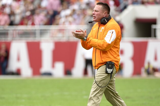 Oct 24, 2015; Tuscaloosa, AL, USA; Tennessee Volunteers head coach Butch Jones cheers on his team against the Alabama Crimson Tide during the first quarter at Bryant-Denny Stadium. Mandatory Credit: John David Mercer-USA TODAY Sports