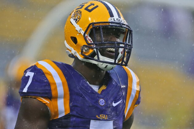 LSU running back Leonard Fournette  warms up in the rain before an NCAA college football game against Western Kentucky in Baton Rouge, La., Saturday, Oct. 24, 2015. (AP Photo/Jonathan Bachman)