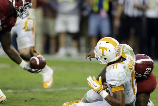 Alabama defensive lineman A'Shawn Robinson (86) recovers a fumble caused by the sack of Tennessee  quarterback Joshua Dobbs (11) by Alabama linebacker Ryan Anderson (22) during the second half of an NCAA college football game, Saturday, Oct. 23, 2015, in Tuscaloosa, Ala. (AP Photo/Butch Dill)