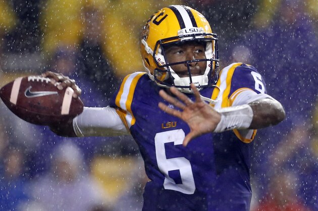 In the rain, LSU quarterback Brandon Harris (6) throws the ball during the first half an NCAA college football game against Western Kentucky in Baton Rouge, La., Saturday, Oct. 24, 2015. (AP Photo/Jonathan Bachman)