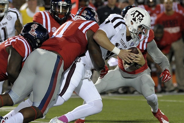 Oct 24, 2015; Oxford, MS, USA; Mississippi Rebels defensive end Channing Ward (11) tackles Texas A&M Aggies quarterback Kyle Allen (10) during the game at Vaught-Hemingway Stadium. Mandatory Credit: Justin Ford-USA TODAY Sports