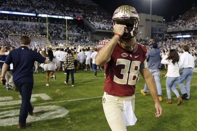 Florida State punter Cason Beatty (38) walks off the field after the second half of an NCAA college football game against Georgia Tech, Saturday, Oct. 24, 2015, in Atlanta. Georgia Tech won 22-16. (AP Photo/Mike Stewart)