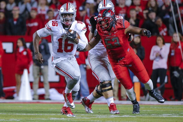 Oct 24, 2015; Piscataway, NJ, USA;  Ohio State Buckeyes quarterback J.T. Barrett (16) turns up field during the first quarter against the Rutgers Scarlet Knights at High Points Solutions Stadium. Mandatory Credit: Jim O'Connor-USA TODAY Sports