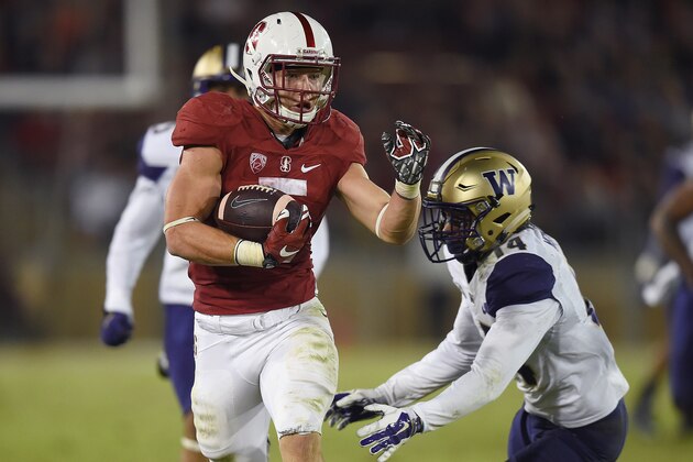 STANFORD, CA - OCTOBER 24:  Christian McCaffrey #5 of the Stanford Cardinal's scores a touchdown breaking the tackle of  JoJo McIntosh #14 of the Washington Huskies in the third quarter of an NCAA football game at Stanford Stadium on October 24, 2015 in Stanford, California.  (Photo by Thearon W. Henderson/Getty Images)