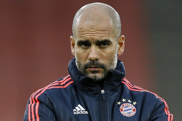 Bayern's head coach Pep Guardiola watches his players during a soccer training session at Emirates stadium in London Monday, Oct. 19, 2015. Arsenal will play Bayern Munich in a Champions League Group F soccer match at the stadium on Tuesday. (AP Photo/Kirsty Wigglesworth)