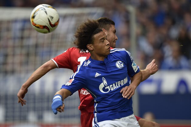 Schalke's Leroy Sane, front, misses the ball during the German Bundesliga soccer match between FC Schalke 04 and 1.FC Cologne in Gelsenkirchen, Germany, Sunday, Oct. 4, 2015. (AP Photo/Martin Meissner)