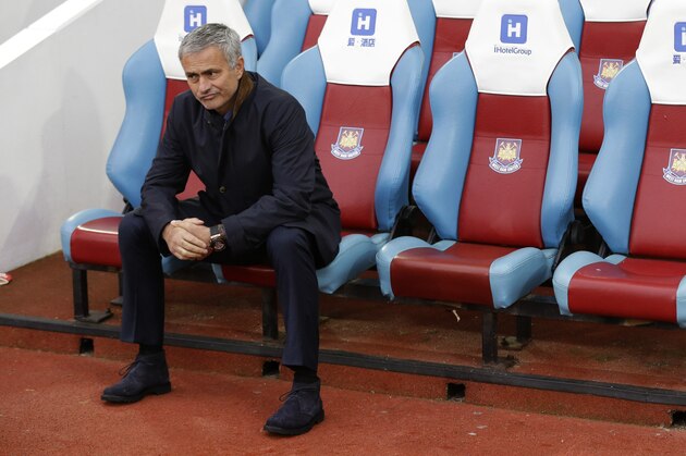 Chelsea's head coach Jose Mourinho waits for the match to start after taking his seat pitch side, prior to the start of the English Premier League soccer match between West Ham and Chelsea at Upton Park stadium in London, Saturday, Oct. 24, 2015.  (AP Photo/Matt Dunham)