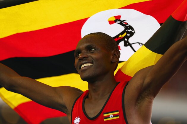 GLASGOW, SCOTLAND - AUGUST 01:  Moses Kipsiro of Uganda celebrates winning gold in the Men's 10,000 metres final at Hampden Park during day nine of the Glasgow 2014 Commonwealth Games on August 1, 2014 in Glasgow, United Kingdom.  (Photo by Ryan Pierse/Getty Images)