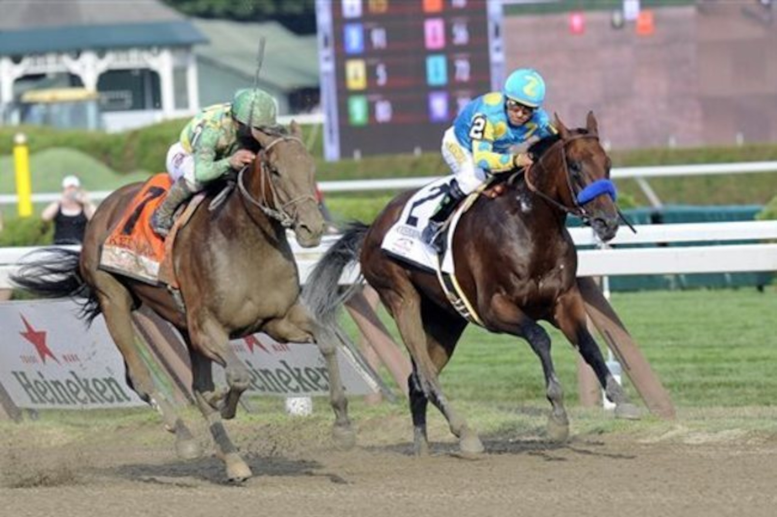 FILE - In this Aug. 29, 2015, file photo, Keen Ice (7) with Javier Castellano up, moves past Triple Crown winner American Pharoah (2), with Victor Espinoza up, to win the Travers Stakes horse race at Saratoga Race Course in Saratoga Springs, N.Y. Triple Crown champion American Pharoah, two-time Breeders' Cup winner Beholder and Travers winner Keen Ice will square off in the $5 million Breeders' Cup Classic next week, with 2014 Belmont Stakes winner Tonalist in the field, too. (AP Photo/Hans Pennink, File)