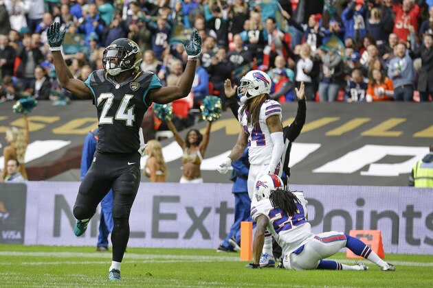 Jacksonville Jaguars running back T.J. Yeldon (24) celebrates after scoring a touchdown during the NFL game between Buffalo Bills and Jacksonville Jaguars at Wembley Stadium in London,  Sunday, Oct. 25, 2015. (AP Photo/Matt Dunham)