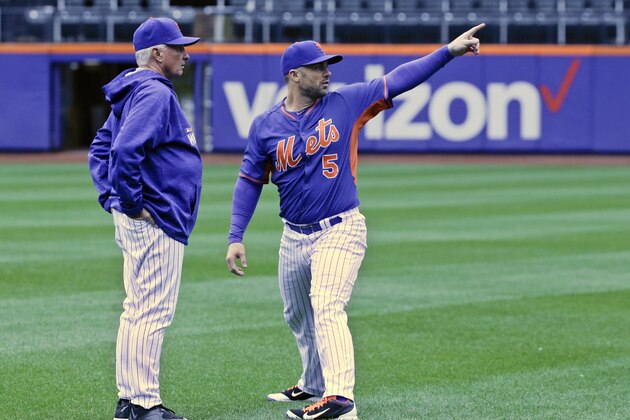 New York Mets third baseman David Wright (5) talks with manager Terry Collins during a baseball workout, Saturday, Oct. 24, 2015, in New York. The Mets will face the Kansas City Royals in Game 1 of the World Series on Tuesday in Kansas City. (AP Photo/Julie Jacobson)