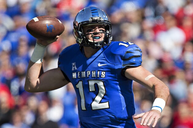 MEMPHIS, TN - OCTOBER 17:  Paxton Lynch #12 of the Memphis Tigers rolls out to pass during a game against the Ole Miss Rebels at Liberty Bowl Memorial Stadium on October 17, 2015 in Memphis, Tennessee.  The Tigers defeated the Rebels 37-24.  (Photo by Wesley Hitt/Getty Images)