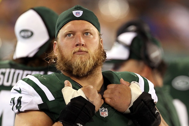 Aug 22, 2014; East Rutherford, NJ, USA; New York Jets center Nick Mangold (74) on the bench against the New York Giants during the second half at MetLife Stadium. The Giants defeated the Jets 35-24. Mandatory Credit: Adam Hunger-USA TODAY Sports