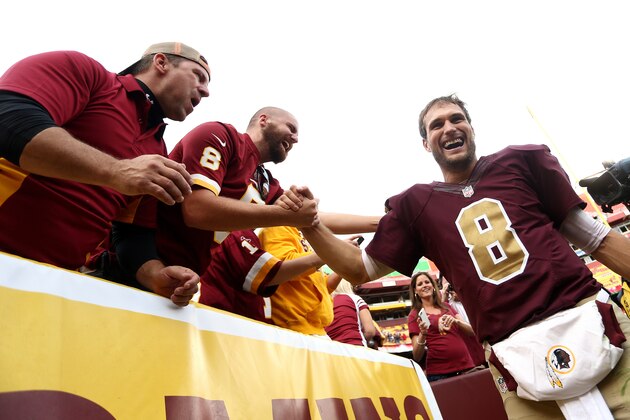 LANDOVER, MD - OCTOBER 25: Quarterback Kirk Cousins #8 of the Washington Redskins celebrates with fans after defeating the Tampa Bay Buccaneers 31-30 during a game at FedExField on October 25, 2015 in Landover, Maryland. (Photo by Matt Hazlett/Getty Images)