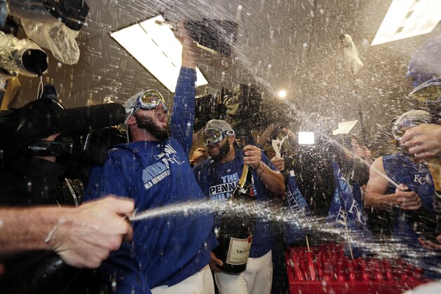 Kansas City Royals celebrates their 4-3 win against the Toronto Blue Jays in Game 6 of baseball's American League Championship Series on Friday, Oct. 23, 2015, in Kansas City, Mo. (AP Photo/Charlie Riedel)